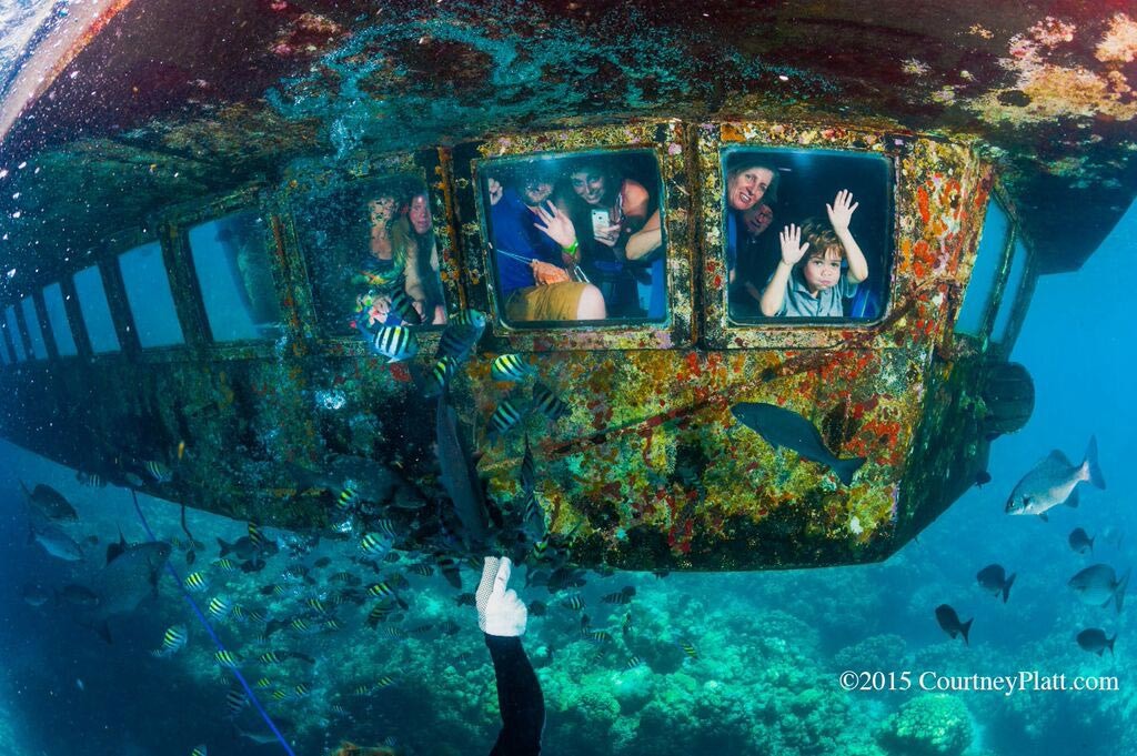 Schoolchildren enjoying an underwater ride aboard the Atlantis Submarine in George Town Harbour.