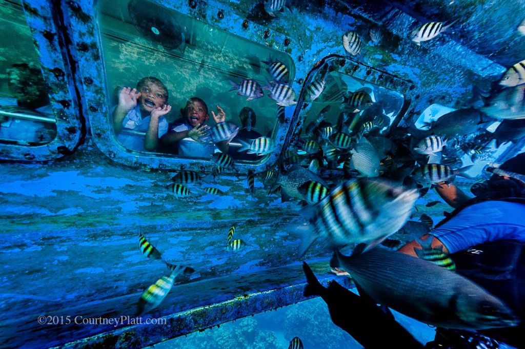 Schoolchildren enjoying the underwater vistas in George Town Harbour aboard the Atlantis Submarine.