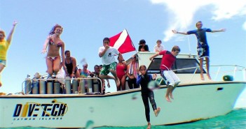 Kids celebrate after a dive during Kids Sea Camp with Divetech in Grand Cayman.