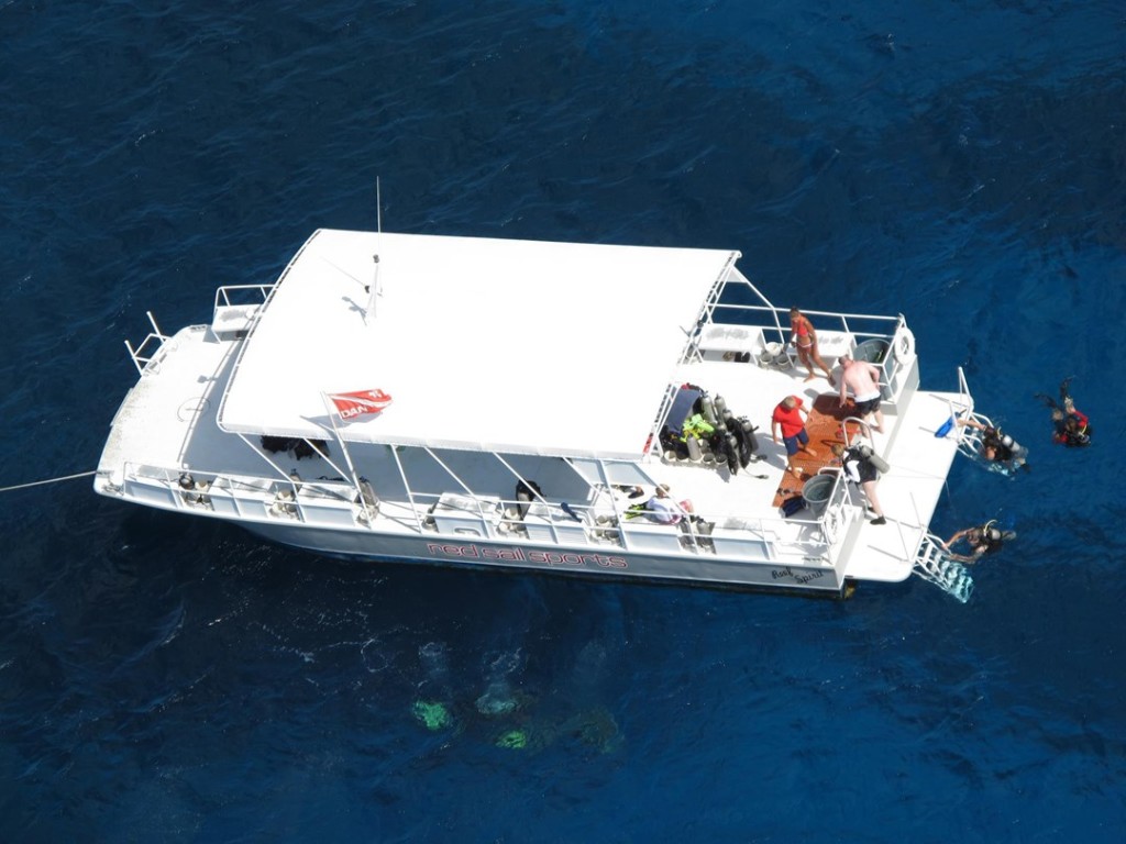 Enjoying a fantastic dive on Cayman's reefs aboard a comfortable and spacious Red Sail Sports dive boat. Photo courtesy Red Sail Sports.