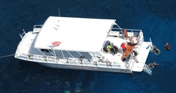 Enjoying a fantastic dive on Cayman's reefs aboard a comfortable and spacious Red Sail Sports dive boat. Photo courtesy Red Sail Sports.