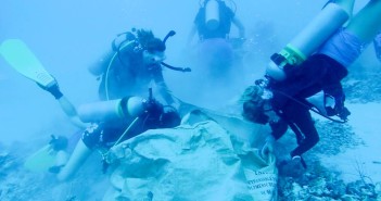 Volunteer divers removing rubble from the damaged coral reef. Photo courtesy Cayman Magic Reef Restoration Project