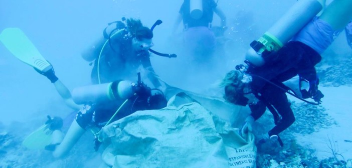Volunteer divers removing rubble from the damaged coral reef. Photo courtesy Cayman Magic Reef Restoration Project