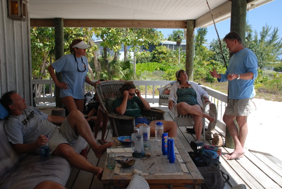 Grouper Moon Project team members discuss the days activities from the porch at Peter Hillenbrand's house on Little Cayman. Live webcasts are streamed from here to local classrooms. Photo courtesy Grouper Moon Project