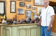 Bob Soto at his home surrounded by artifacts from his diving days. Photo by Chris Court