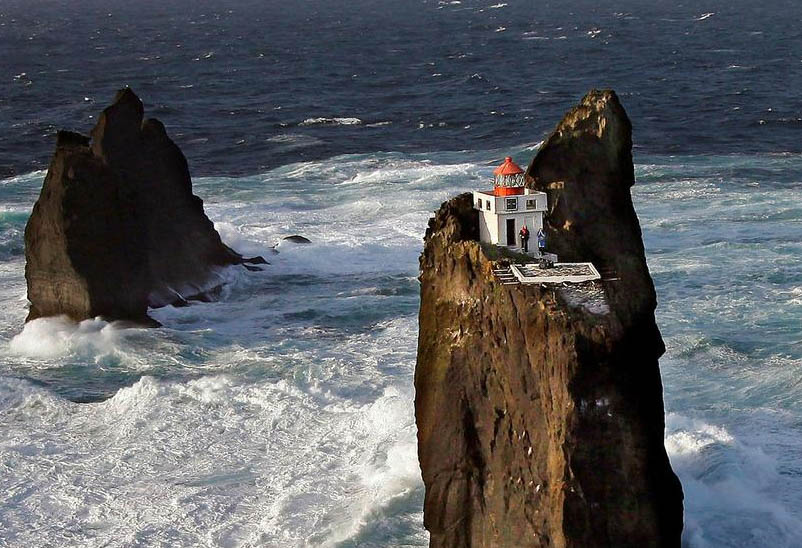 Thridrangaviti Lighthouse; Perched on a Ledge in Iceland's Raging Surf
