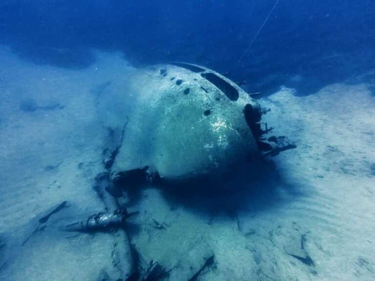 The Karpaz Wreck: Uncovering the Story of MV Città di Alessandria Scuba diver swimming beside large corroded sections of the MV Città di Alessandria wreck