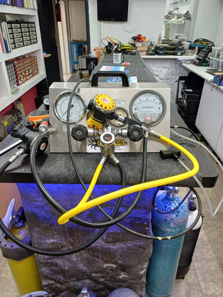 Scubagaskets regulators on a regulator test bench during technical evaluation.